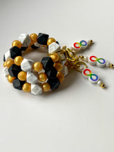 Load image into Gallery viewer, Gradient Spectrum Geometric Keychain Wristlet with Infinity Fidget Charm
