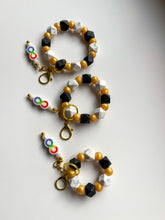 Load image into Gallery viewer, Gradient Spectrum Geometric Keychain Wristlet with Infinity Fidget Charm
